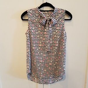 Sleeveless Flowy Blouse with feminine bow detail